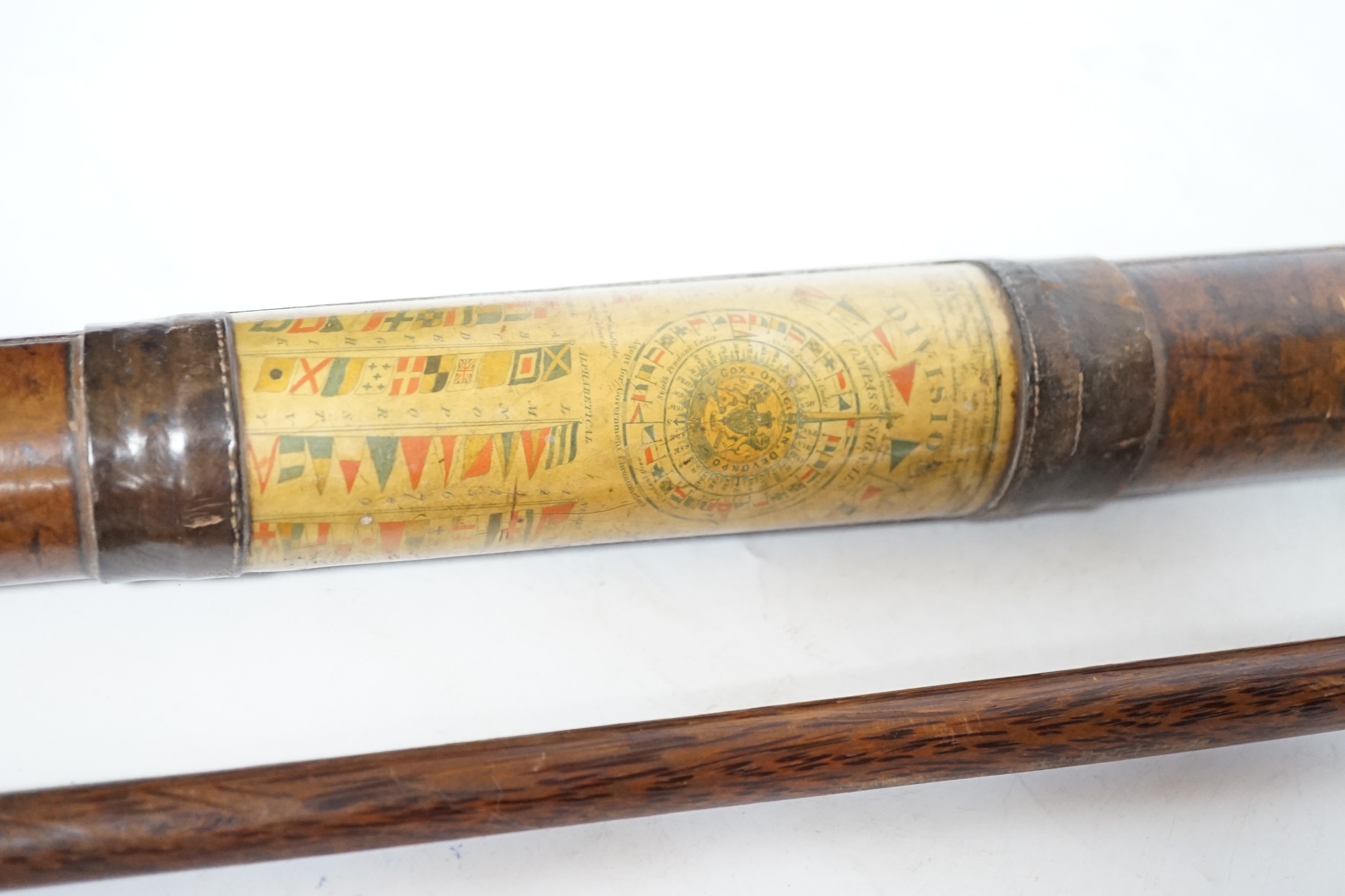 An inscribed cocus wood walking stick with carved handle in the form of a hand, ‘Pitcairn Island’ and a brass mounted two drawer telescope, largest 92cm in length